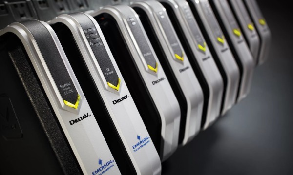 A row of Emerson DeltaV modules operating in a synchronized lineup, with illuminated yellow indicators displaying their active status.