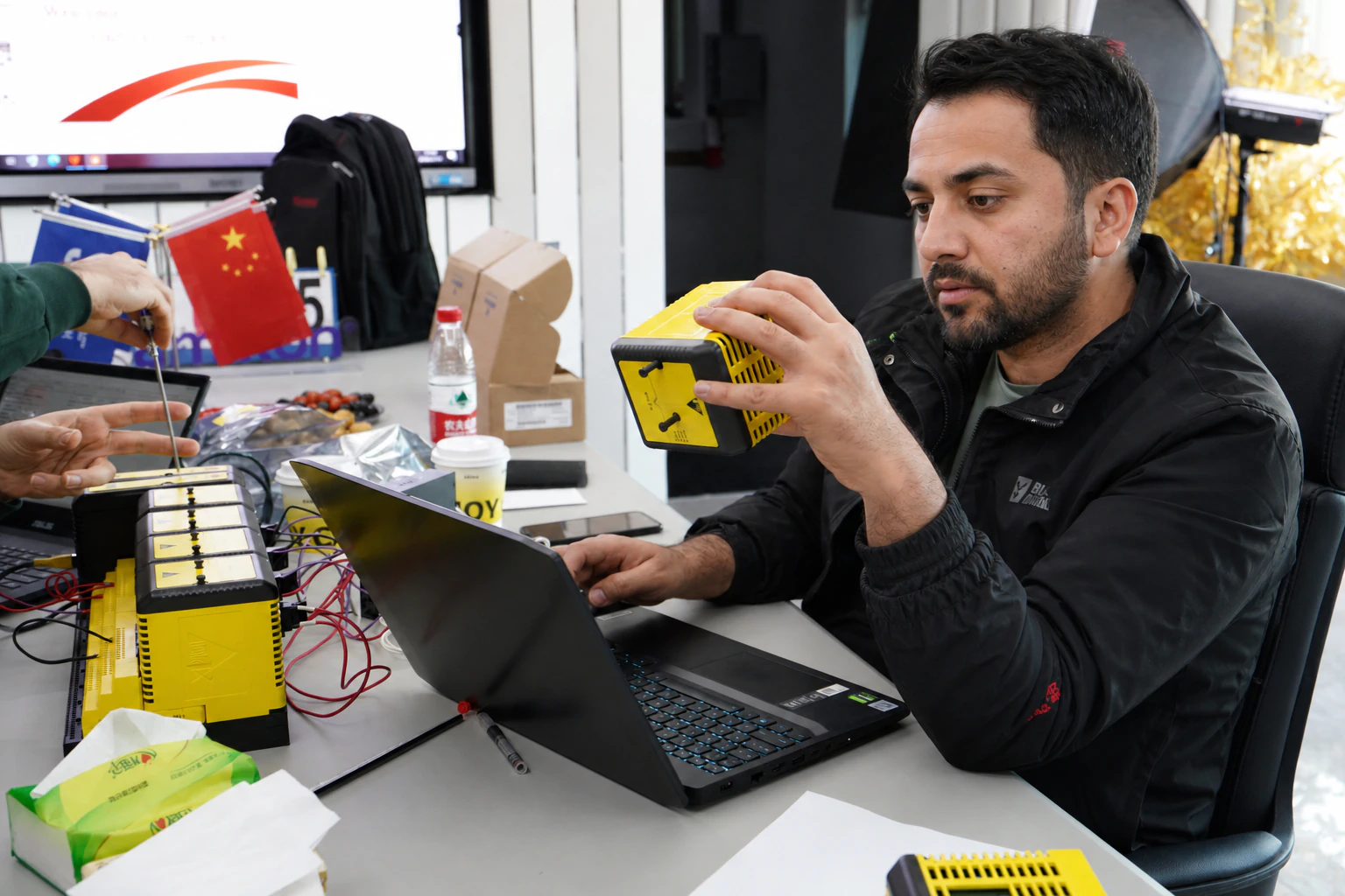 Customer inspecting an Emerson safety logic module during project verification at Apter Power